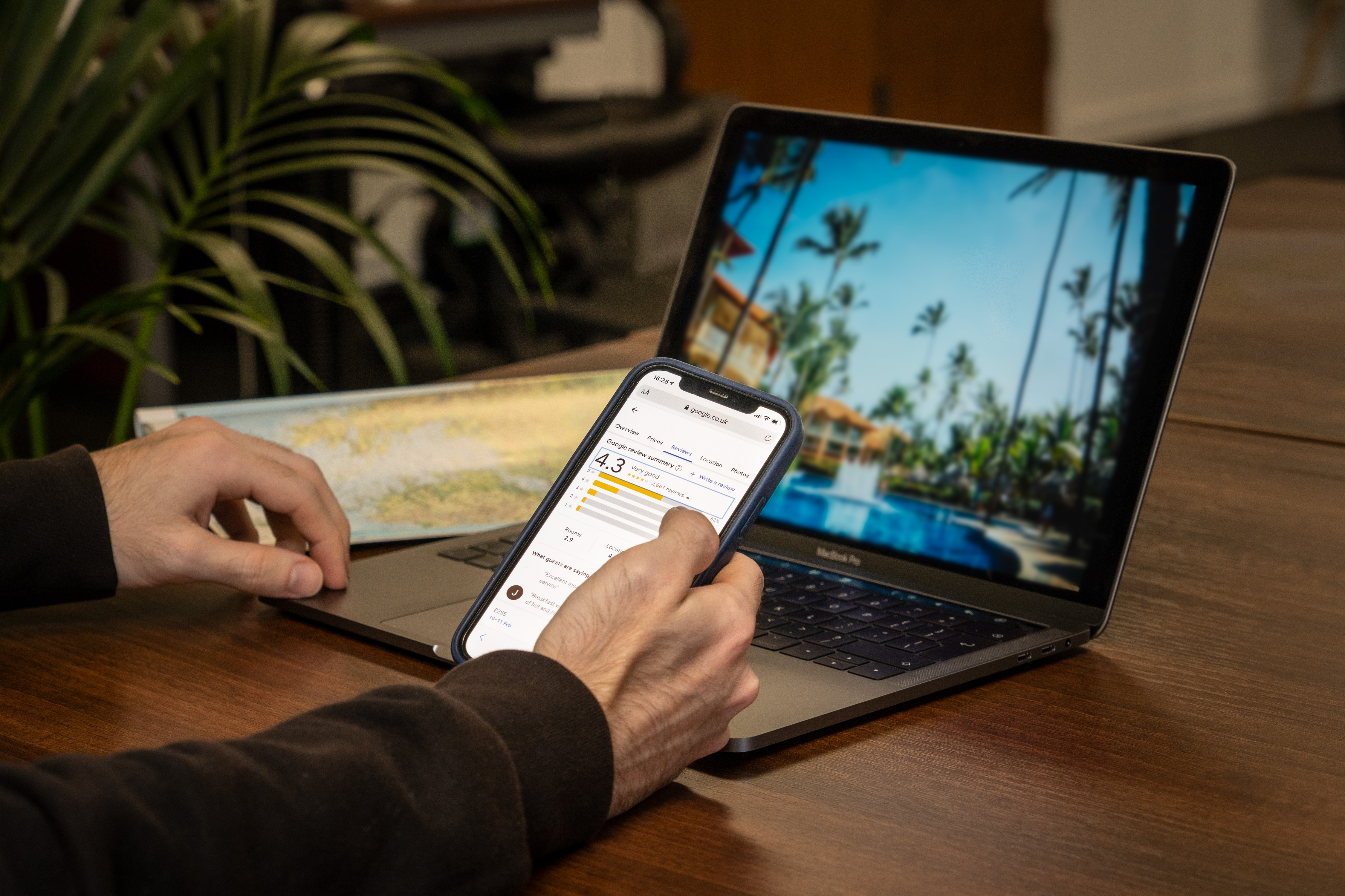 Person managing guest reviews on a laptop